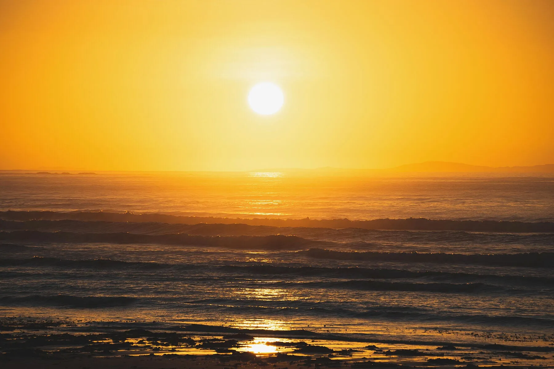 The winter sun setting over Carrowniskey, county Mayo.