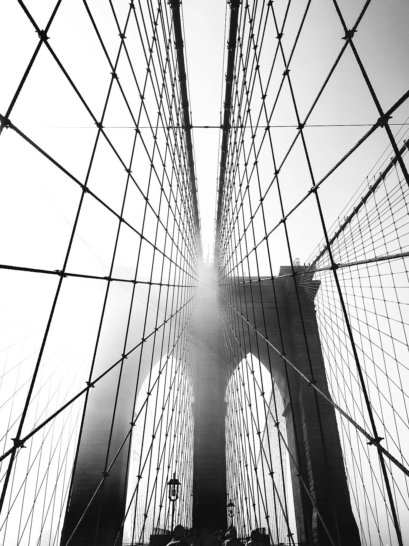 Looking up as I crossed Brooklyn Bridge. Printed on Ilford cotton textured paper - a highly textured art paper that emphasises dark ink and bright whites.